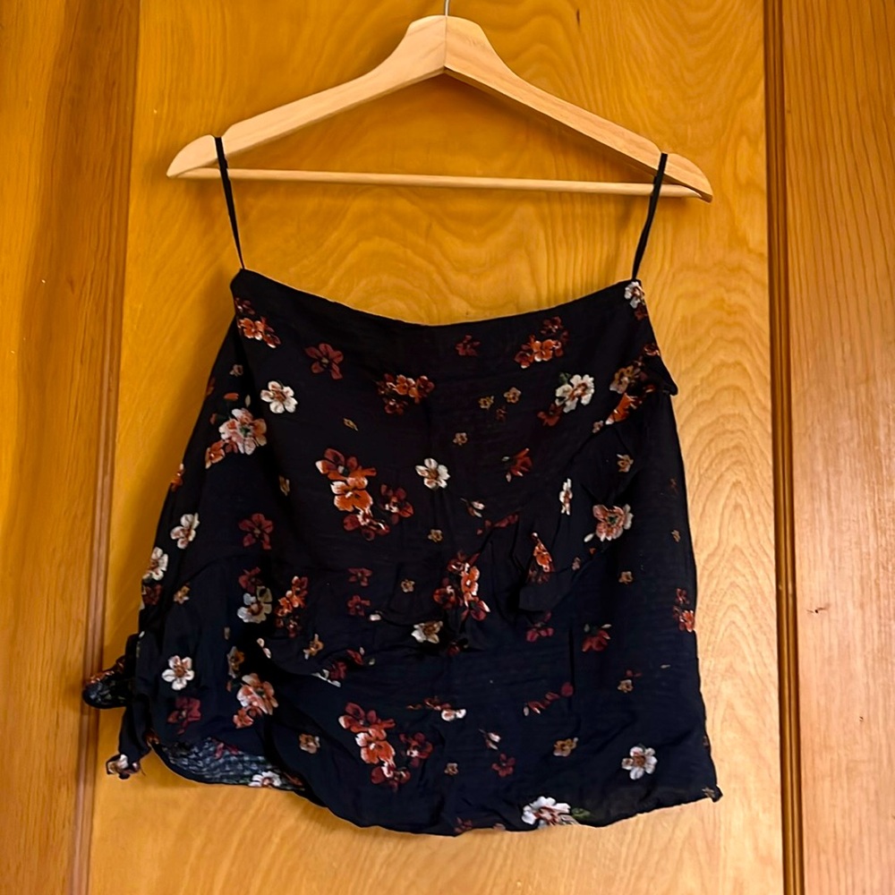 Em&Elle small mini skirt. Black with white and maroon-ish flowers.